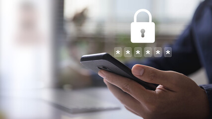 Person using a smartphone with a password input or OTP code and lock icon, emphasizing security and online authentication. data protection and secured internet access.
