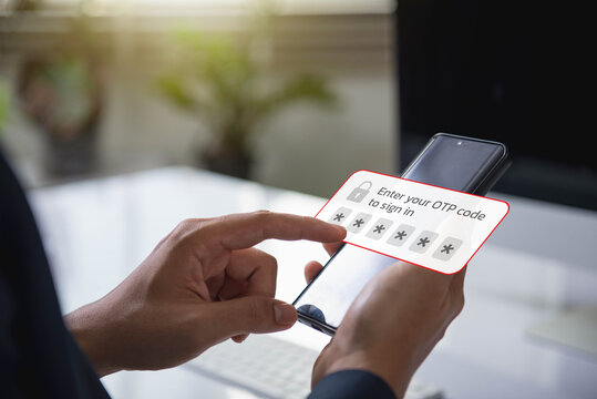 person using a smartphone to enter a one time password (OTP) code for secure two factor authentication. data protection and secured internet access.