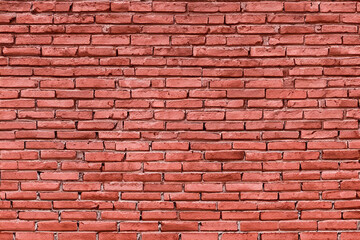 Obraz premium A close-up shot of a red brick wall, featuring a classic brickwork pattern.