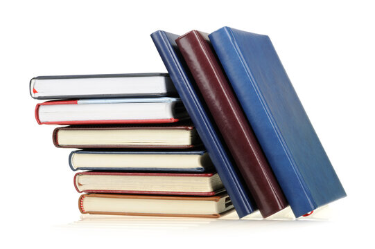 Stack of diaries or books with colorful covers on white background