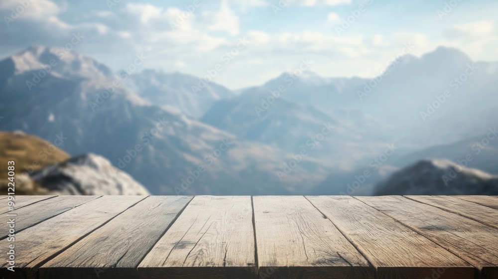 Poster wooden table with a bokeh background featuring mountains offering an empty surface for product displ