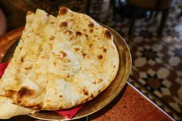 close up of Indian food baked garlic naan 