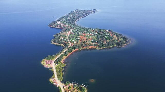 Aerial view of a serene Lake Kivu with majestic mountains behind, Kenya