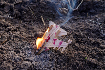 Wreckage fighter jet burning in field. Air Defense Shoots Down Fighter Jet. Toy fighter jet ...