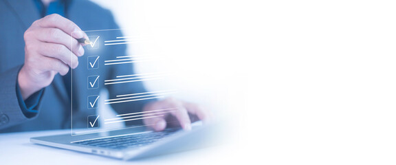 Businessman checklist concept as clipboard document checklist form on the virtual screen Use your...