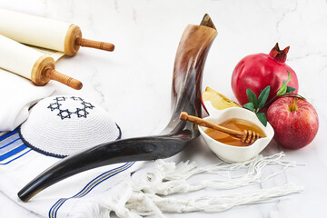 Rosh Hashanah. Jewish New Year composition with shofar, honey, apple, and pomegranate.