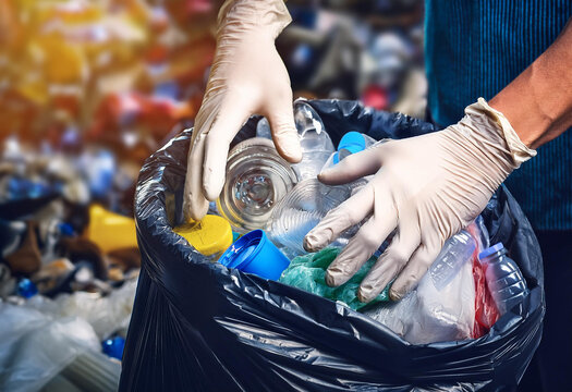 Hands in rubber gloves sorting a garbage, sustainable lifestyle