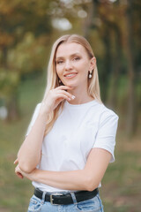 Happy and Confident Blonde Woman Posing in a Park, Portrait Outdoors