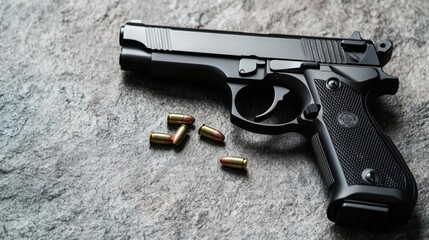 A close-up of a black handgun with spent cartridges on a textured surface, showcasing its sleek design and intricate details.