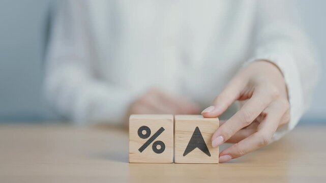 wood block of percentage change to UP and Down arrow. Interest rate, GDP, stocks market, financial, deflation and Inflation, ranking, mortgage, debt, Loan and Economic Recession concept
