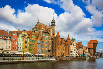 Obraz premium Beautiful city of Gdansk in the margins of the Motlawa river with the touristic boats and coloured buildings