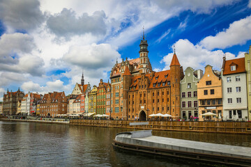 Fototapeta premium Beautiful city of Gdansk in the margins of the Motlawa river with the touristic boats and coloured buildings