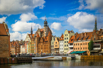 Fototapeta premium Beautiful city of Gdansk in the margins of the Motlawa river with the touristic boats and coloured buildings