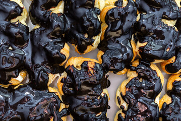 Baked choux pastry without cream and without icing, ready to make eclairs.