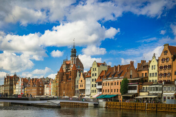 Fototapeta premium Beautiful city of Gdansk in the margins of the Motlawa river with the touristic boats and coloured buildings