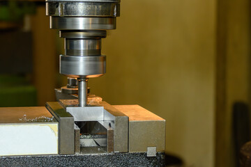 The hole cutting process on NC milling machine by boring tool.
