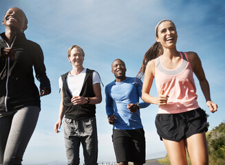 People, athlete and happiness for running on mountain or hill with support, diversity or exercise....