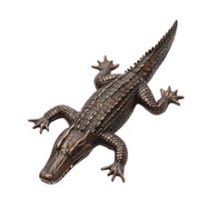 Fototapeta premium A detailed ceramic crocodile sculpture, showcasing intricate textures and a lifelike pose, perfect for home decor or nature-themed art.