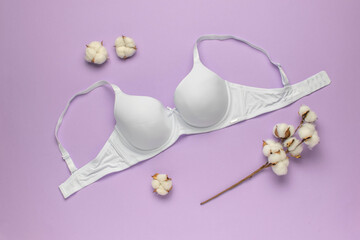 White Cotton Bra on Purple Background with Cotton Flowers - Organic Lingerie and Natural Materials