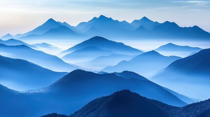 Fototapeta premium Blue Mountain Range Under a Misty Sky