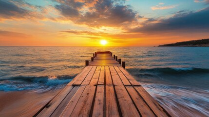 Gorgeous sunset near the beach's wooden jetty
