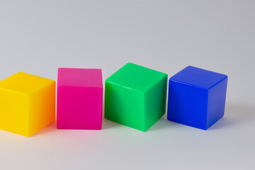 Obraz premium Colored cubes on a white. Cube color concept. A group of colored cubes on a white . A white with colored cubes lifestyle and toys.