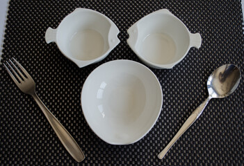 empty plate and cutlery set on a table