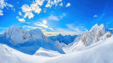Fototapeta premium Expansive winter landscape featuring snow-covered mountains under a clear blue sky with fluffy clouds and bright sunlight