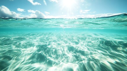Crystal clear ocean water illuminated by the sun, creating beautiful patterns and reflections on the surface.