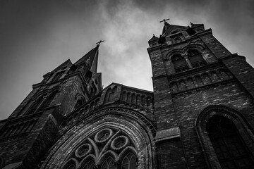 Gothic church architecture with spiers and beautiful arched glass windows, Christian religion and...
