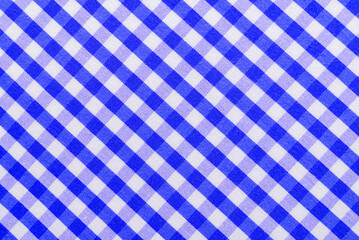 Checkered blue fabric. Textile. Checkered fabric background with blue and white cells