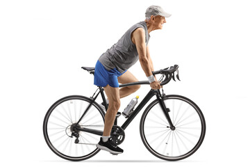 Naklejka premium Fit elderly man riding a bicycle