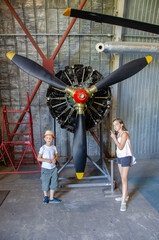 detail of old airplane engine with propeller. Close up of a red plane propeller. Damaged jet engine...