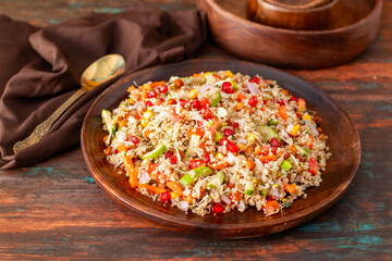 Vibrant Quinoa Salad with Fresh Vegetables, Tangy Citrus Dressing, Crunchy Nuts, Avocado, and a Zesty Herb Infusion.