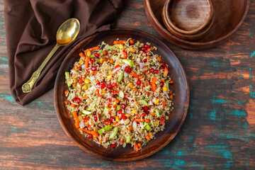 Vibrant Quinoa Salad with Fresh Vegetables, Tangy Citrus Dressing, Crunchy Nuts, Avocado, and a Zesty Herb Infusion.