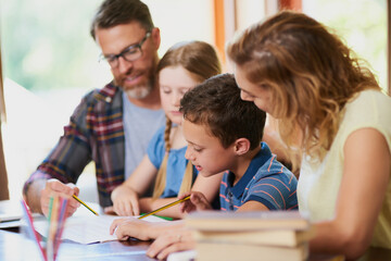 Family, children and learning with books on table for homework, education or assignment at home....