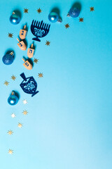 Hanukkah Jewish holiday background with menorah (candelabra) and traditional Dreidel game toy.