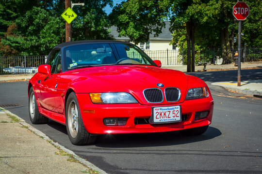 Red BMW Z3 convertible parked on Quiet Neighborhood Street, on August 12, 2024, Brighton, Massachusetts, USA