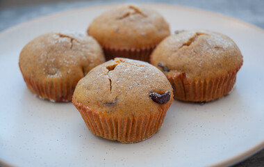 Muffins with cranberry close up on a plate.