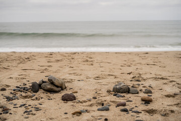 Focus on Beach Rocks on Sand Dramatic