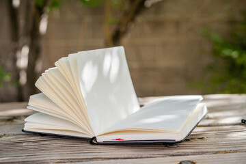 Open Pages Journal Notebook Outside on Picnic Table