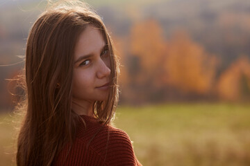 Fototapeta premium girl enjoying warm autumn in the park, hello autumn, autumn mood