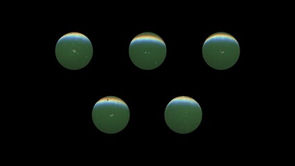 a set of green clear circles, empty stationery tacks, front view, isolated metal push rounded pins on black background