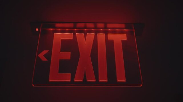 Red exit sign in the dark. Exit emergency sign in red. The red way out announcement on the dark background. 
