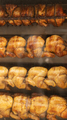 Roasted Whole Chicken Hanging in Restaurant Window ready To Order