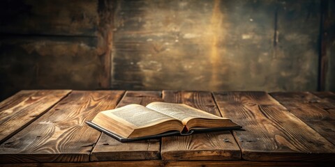 Vintage wooden table with ancient bible book, religious scripture on old rustic desk