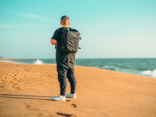 man walking on the beach