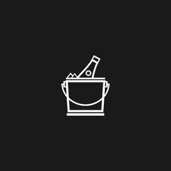 Bottle of champagne in an ice bucket isolated on black background.