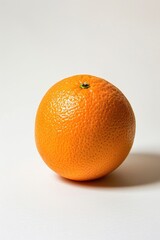 A single orange sitting on a clean white surface