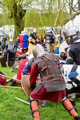 Knight fight, show fight of disguised knights and warriors, medieval soldiers with swords and shields at medieval market in Graefenthal Monastery, Goch, Kleve, North Rhine-Westphalia